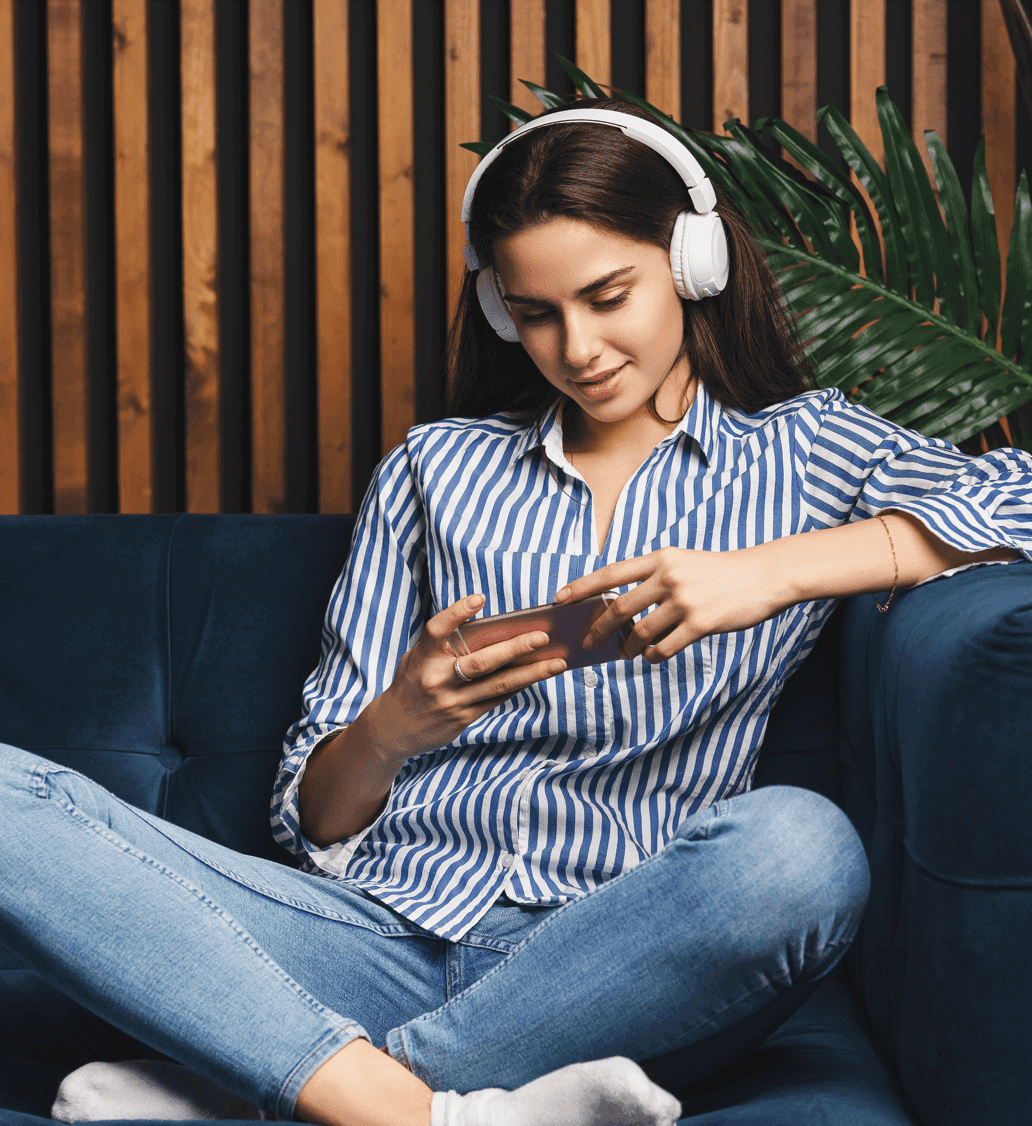 A girl enjoying fever fm with headphones